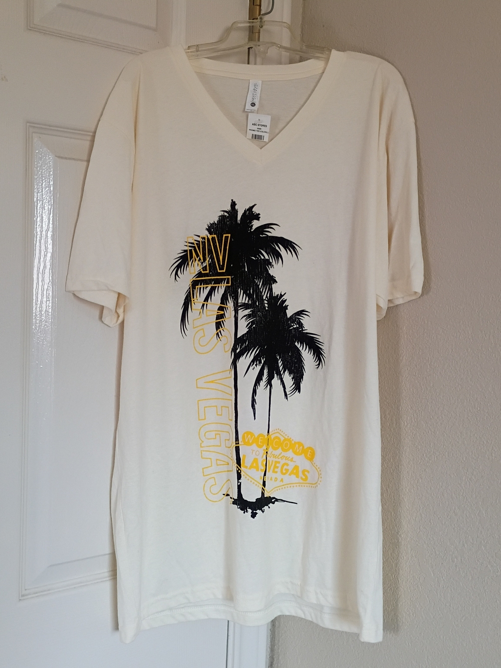 Next Level Apparel Cream V-Neck Palm Graphic Tee with Black and Yellow Print